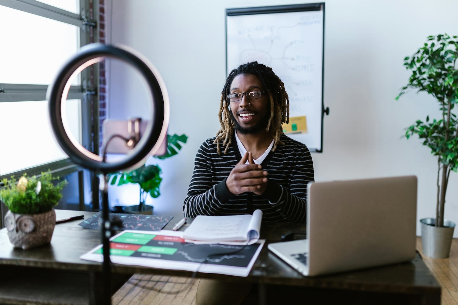 A man recording tips on how to become an influencer.