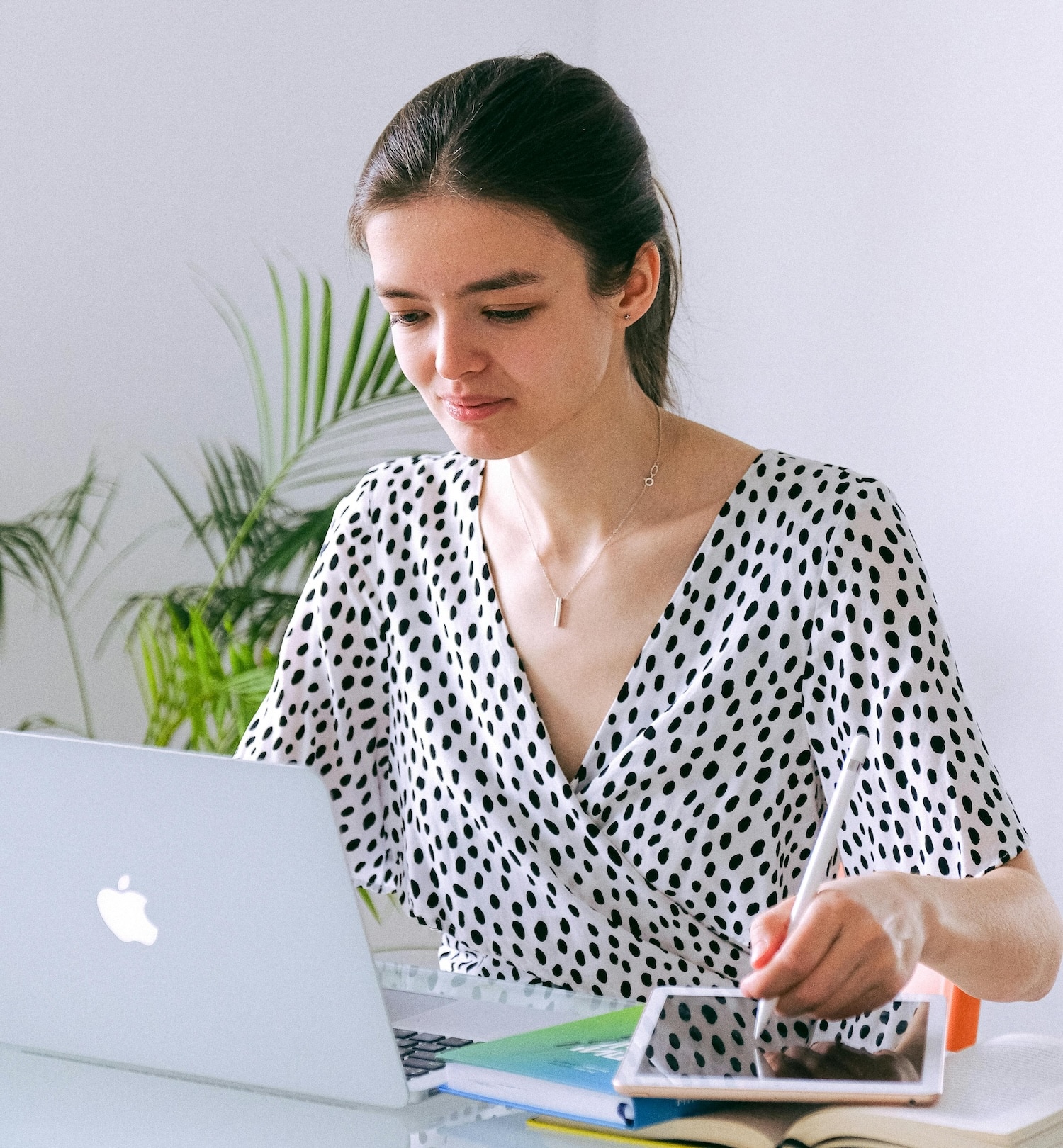 A woman on her laptop learning how to use affiliate marketing on Pinterest.