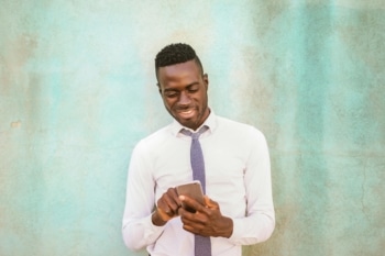 A man is looking up the guidelines of how to go viral on TikTok.